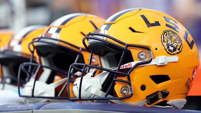 LSU football helmet sit on a bench